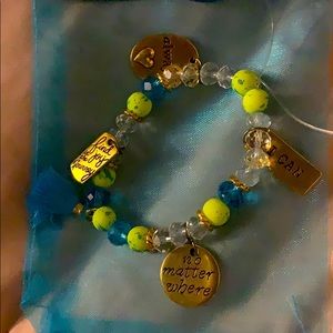 A Lime green/turquoise bracelet including a tassel